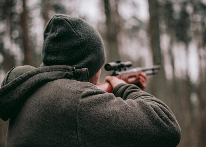 man using sniper rifle