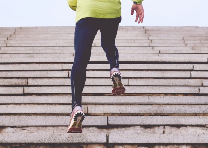 person climbing concrete stairs